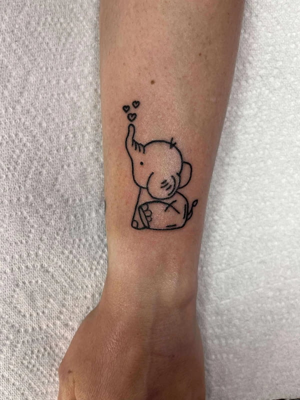 Fine line elephant tattoo with intricate details and minimalist design