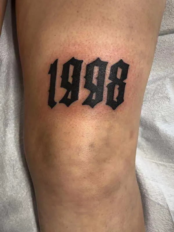 Fine line numbers tattoo with precise numerical design and minimal styling