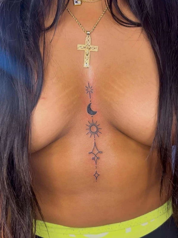 Fine line star and moon tattoo with celestial elements and precise linework