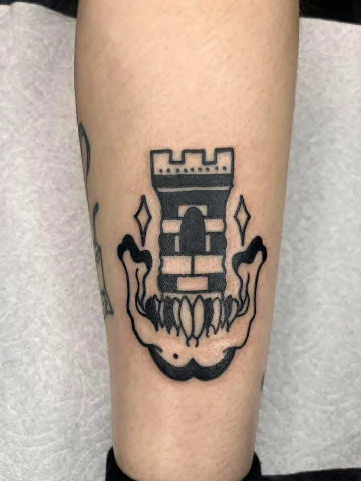 Traditional butterfly and skull combination tattoo with symbolic imagery