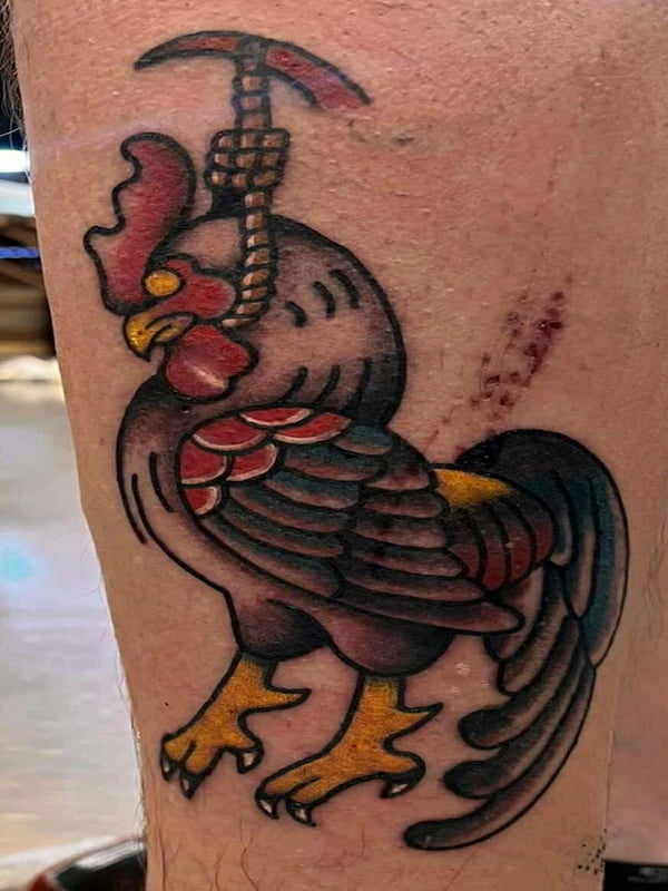 Traditional rooster tattoo with bold colors and classic American traditional design