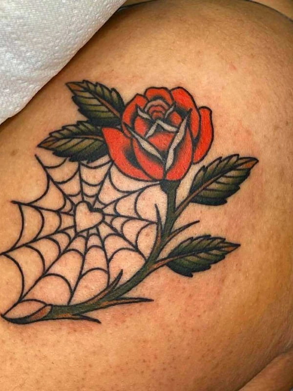 Traditional style rose tattoo with bold lines and classic American traditional design