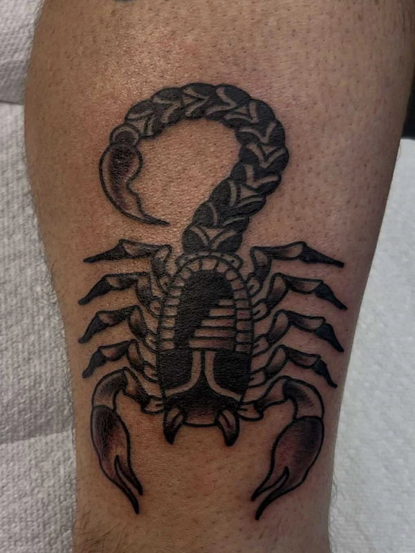 Traditional scorpion design tattoo with classic American traditional elements