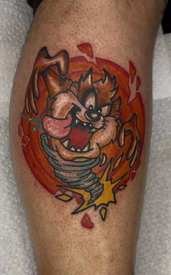 Traditional Tasmanian Devil cartoon character tattoo with flames
