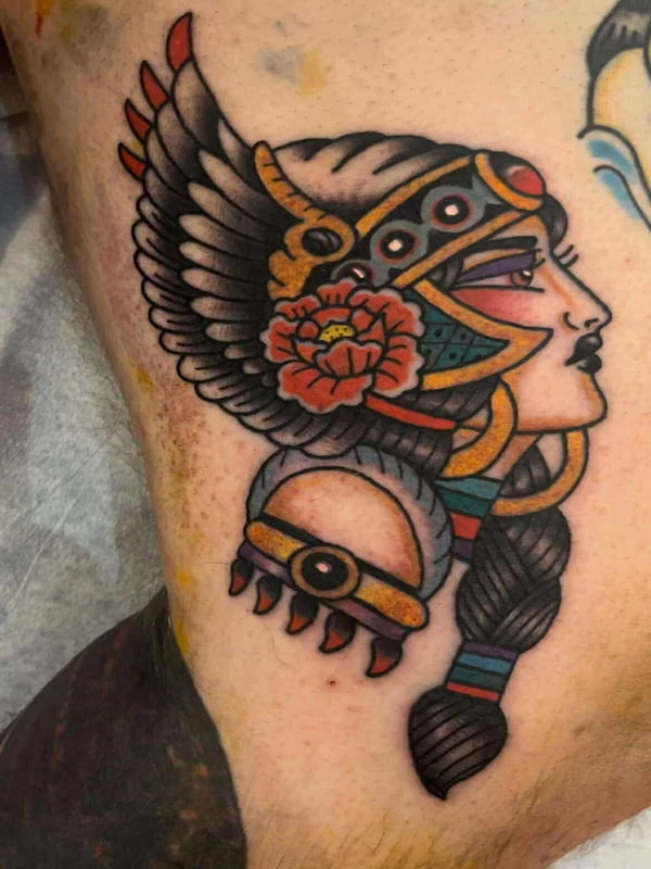 Traditional valkyrie lady head tattoo with wings, warrior helmet, and rose