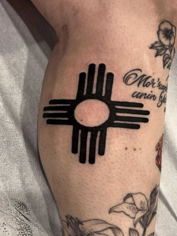 Traditional New Mexico Zia sun symbol tattoo in solid black
